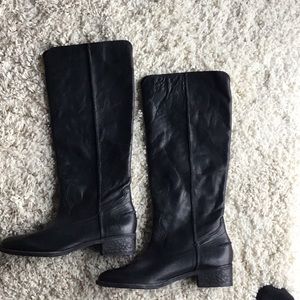 Black full leather Knee High Frye boots.